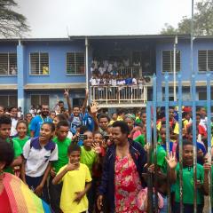 A schoolyard full of students in Papua New Guinea.
