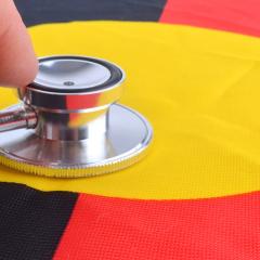 stethoscope on the Australian Aboriginal Flag 