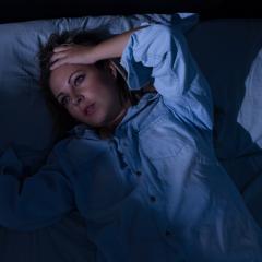 Woman experiencing night sweats