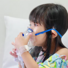 child wearing oxygen mask