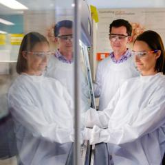Raquel McGill in the research lab with Associate Professor Trent Woodruff.