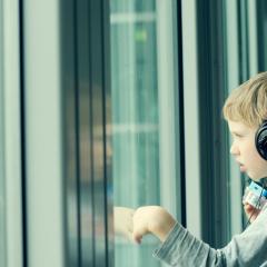 Image of a boy wearing headphones.