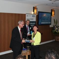 The Royal Australasian College of Physicians president Professor Nick Talley presents News Ltd’s Janelle Miles with the M+BS Excellence in Media Engagement Award as Faculty of Medicine and Biomedical Sciences Executive Dean Professor Nick Fisk looks on.