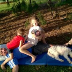 Retiring professor, Jake Najman, with two of his grandchildren and dog, Matzo