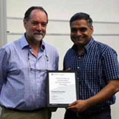 Dr Prasad Chunduri receives his award from Associate Dean (Academic) Geoff Marks.