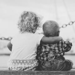 Image of two children on a jetty