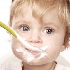 Image of toddler eating yogurt