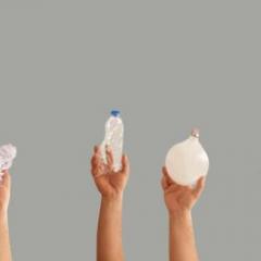 hands holding plastic hospital waste
