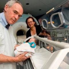 Prof. Roslyn Boyd (UQ); Prof. Paul Colditz (UQ, QLD Health) with the first preterm baby to be scanned using the MR compatible incubator.
